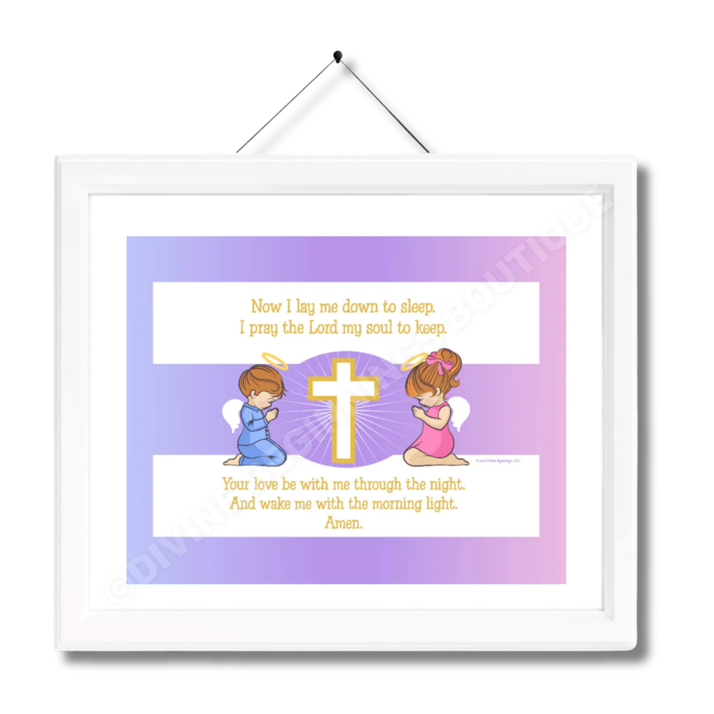 A framed artwork featuring two cartoon children with brunette hair, praying beside a cross with a printed bedtime prayer text.