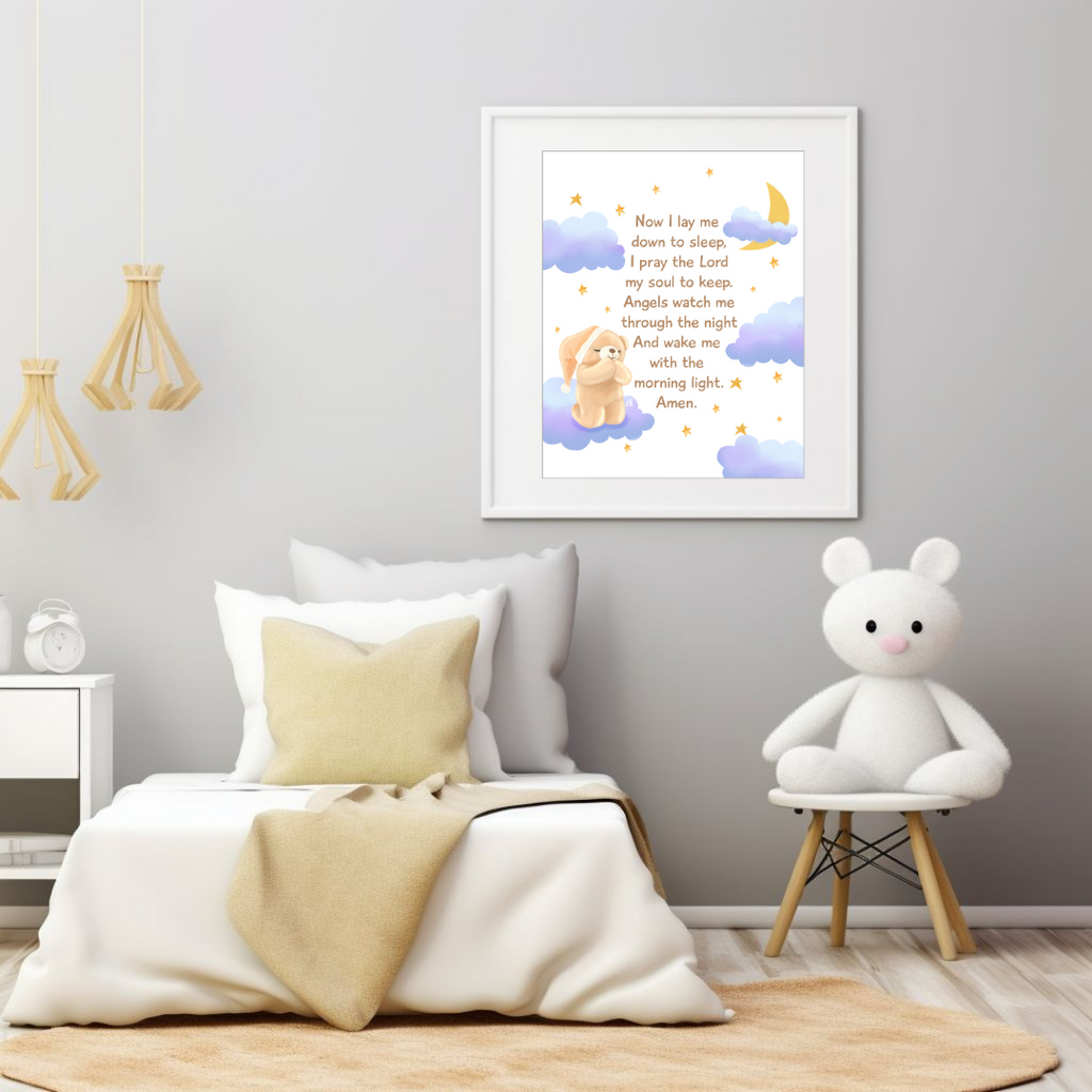 Children's bedroom with a framed picture of a teddy bear and text, a white teddy bear on a stool, and a bed with pillows and blanket.